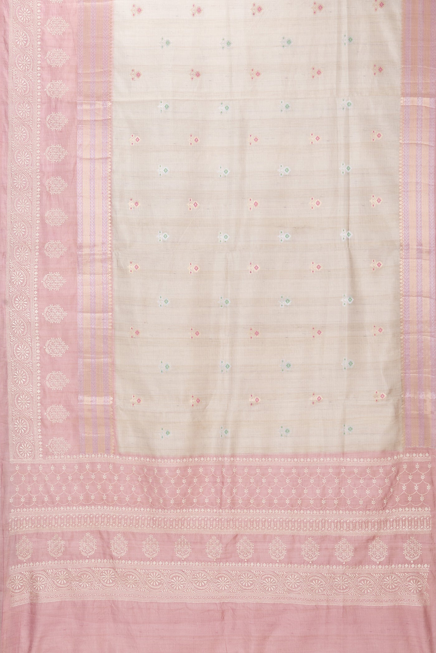 Flat view of Beige Blended Tussar Silk Saree with Zari Butta on the body and Zari Border. 