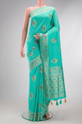 Sea Green Dual Tone Blended Banarasi Georgette Saree with Zari Brocade on the body and Zari Border.  displayed on a mannequin