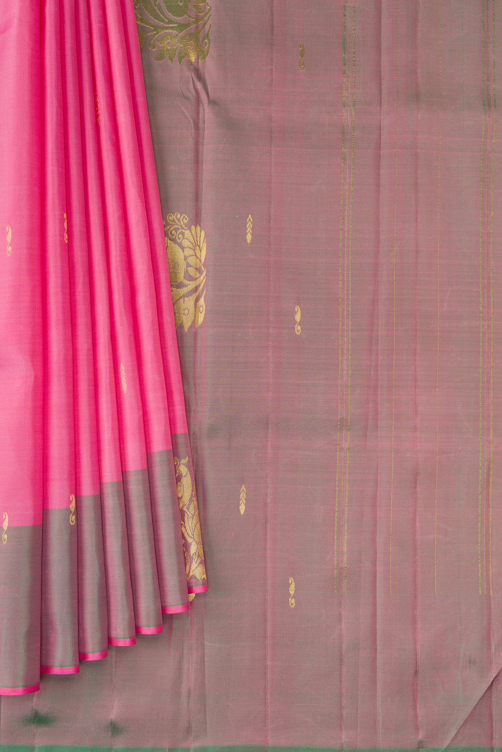 Pleats and pallu of Pink Kanjivaram Silk Saree with Zari Butta on the body and Zari Border. 