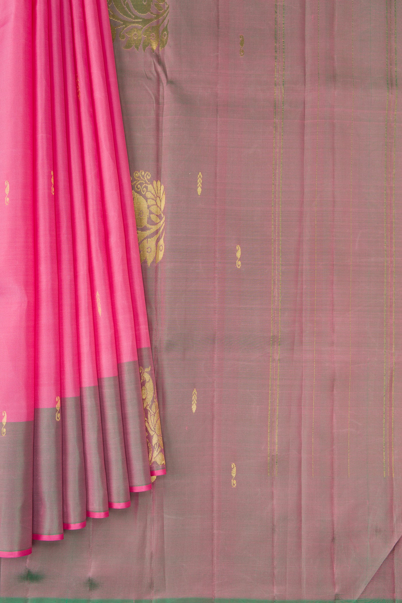 Pleats and pallu of Pink Kanjivaram Silk Saree with Zari Butta on the body and Zari Border. 