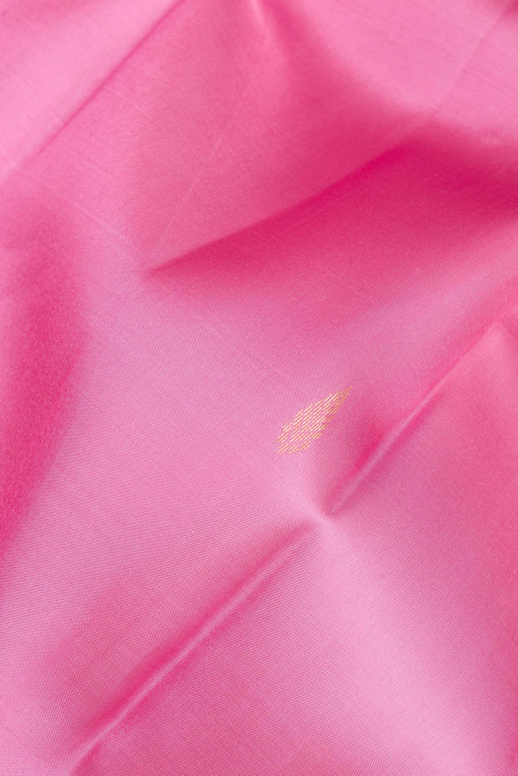 Close up of Pure Silk Rose pink Kanjivaram Saree with Zari Butta on the body and Without Border.  displaying folds
