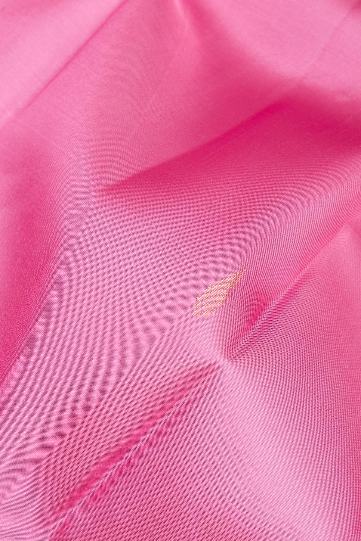 Close up of Pure Silk Rose pink Kanjivaram Saree with Zari Butta on the body and Without Border.  displaying folds