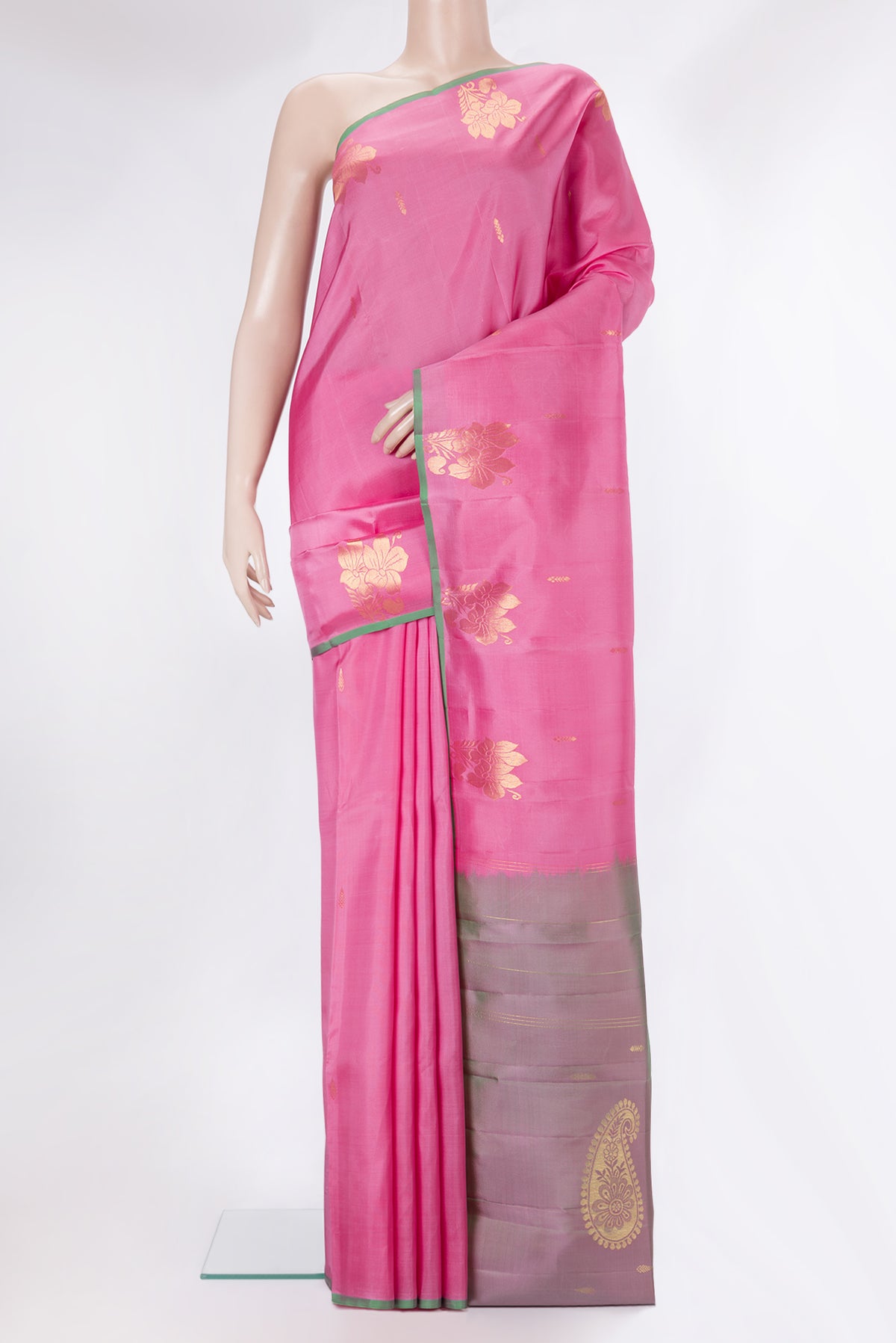 Pure Silk Rose pink Kanjivaram Saree with Zari Butta on the body and Without Border.  displayed on a mannequin