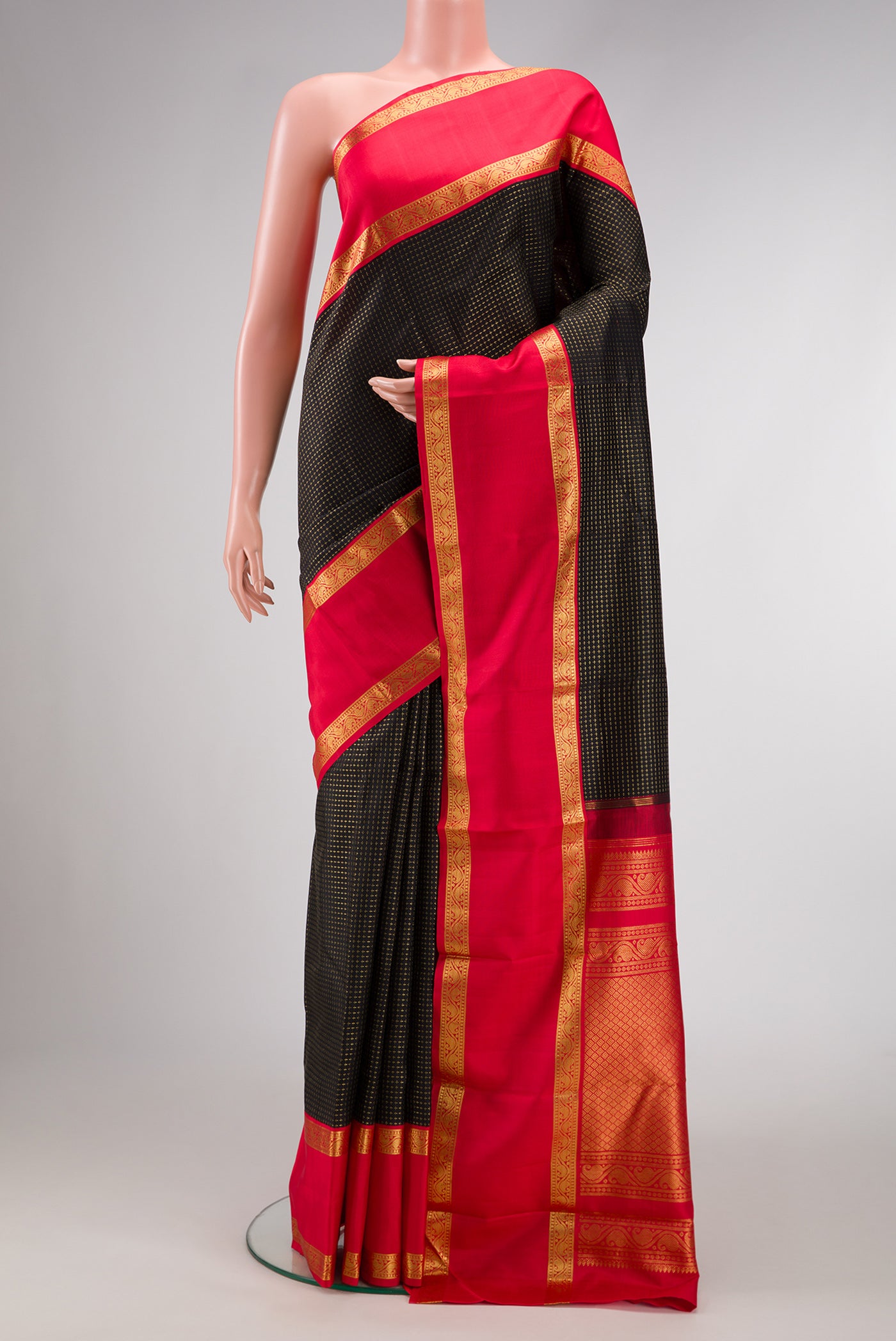 Black Dual Tone Kanjivaram Silk Saree with Checked design on the body and Zari Border.  displayed on a mannequin