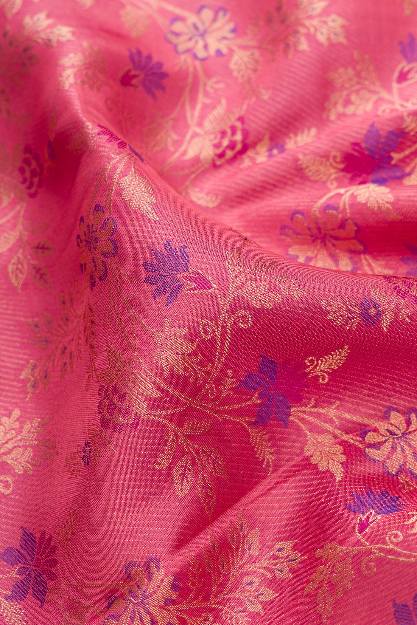 Close up of Pink Dual Tone Kanchipuram Tissue Silk Saree with Zari Brocade on the body and Fancy Border.  displaying folds