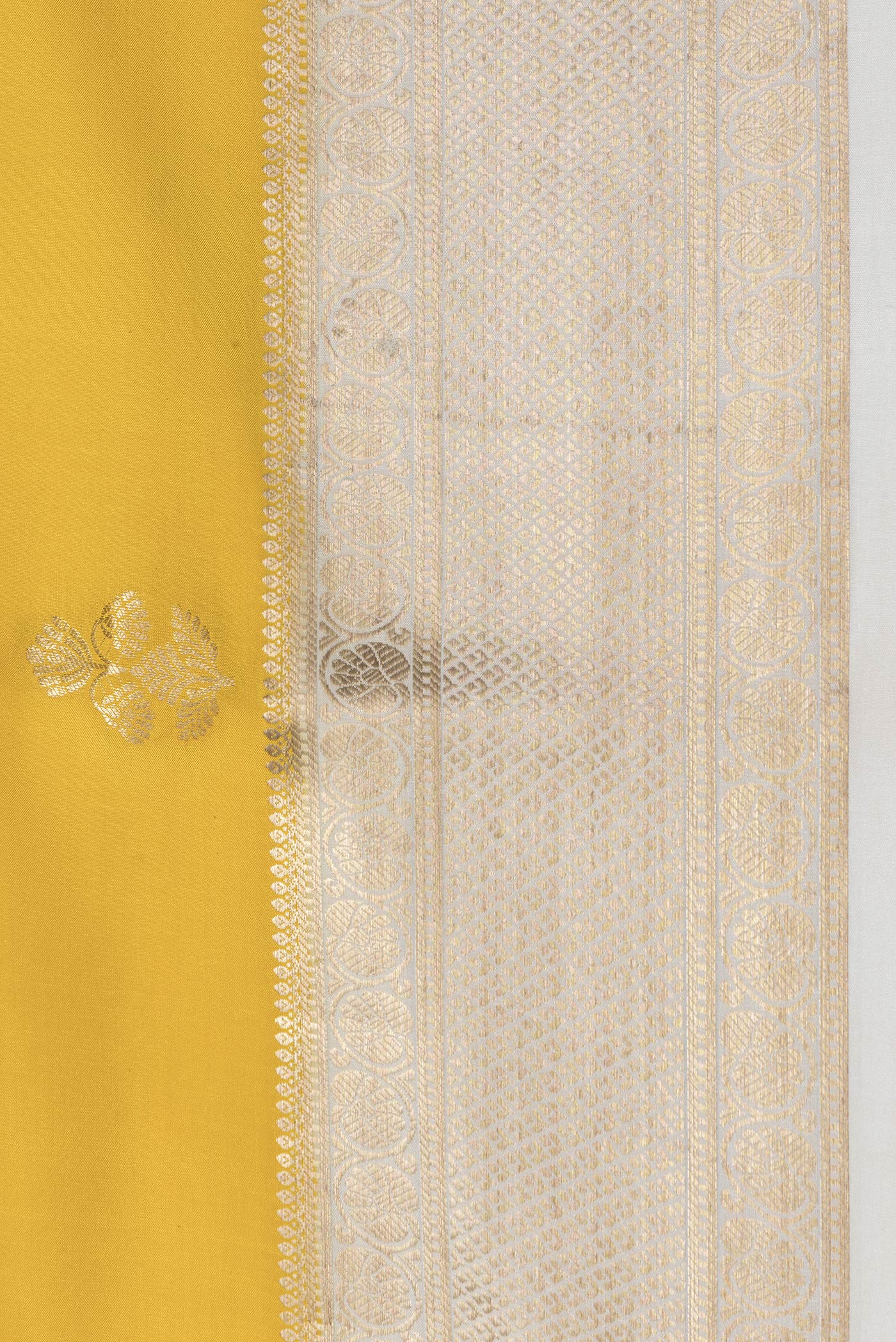 Border image of Yellow Dual Tone Mysore Silk Saree with Zari Butta on the body and Zari Border. 