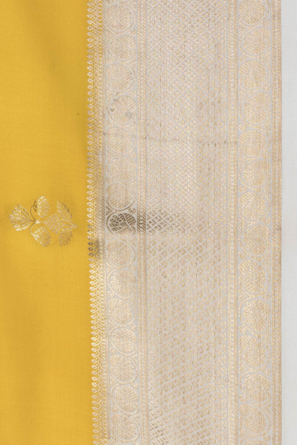 Border image of Yellow Dual Tone Mysore Silk Saree with Zari Butta on the body and Zari Border. 