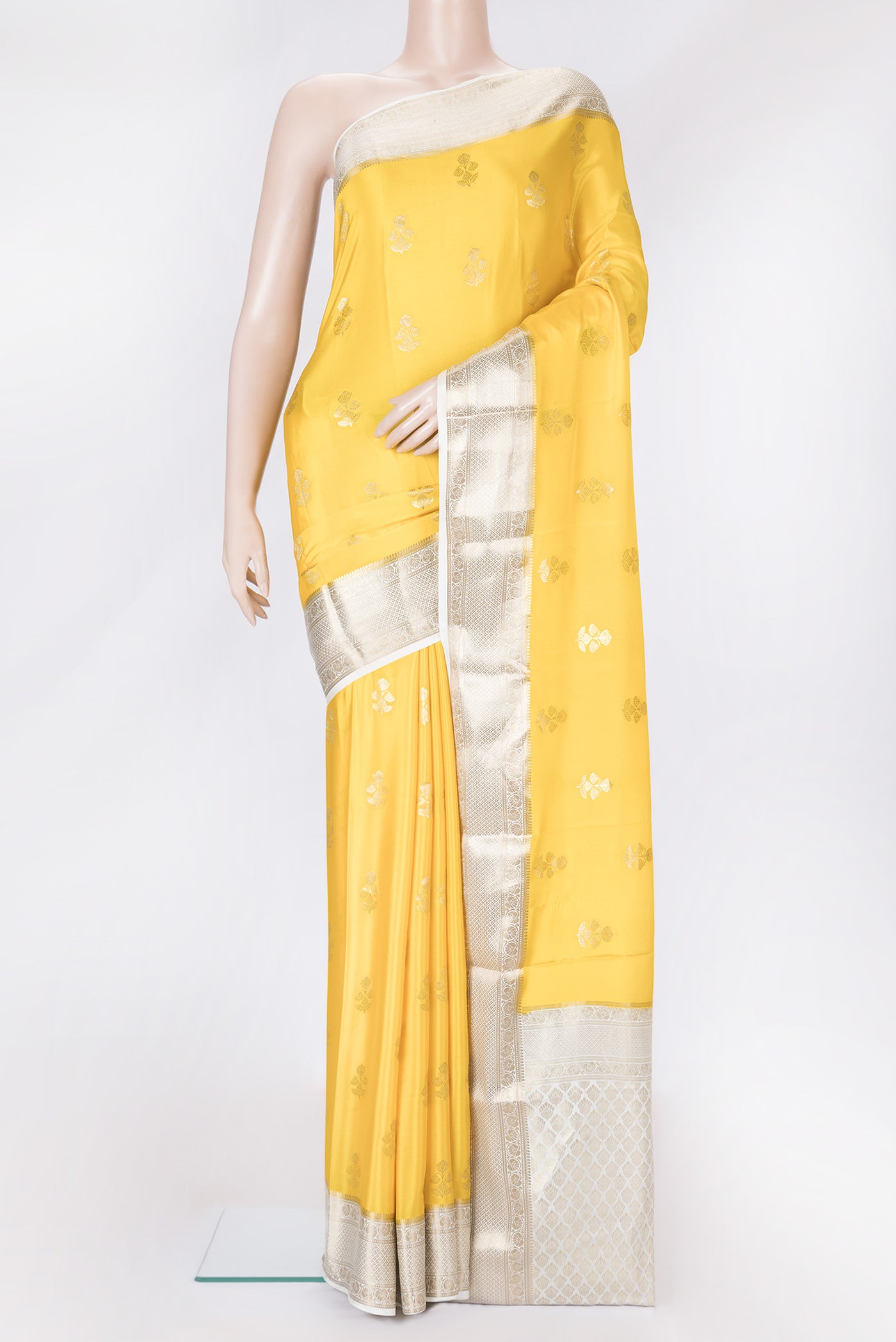 Yellow Dual Tone Mysore Silk Saree with Zari Butta on the body and Zari Border.  displayed on a mannequin