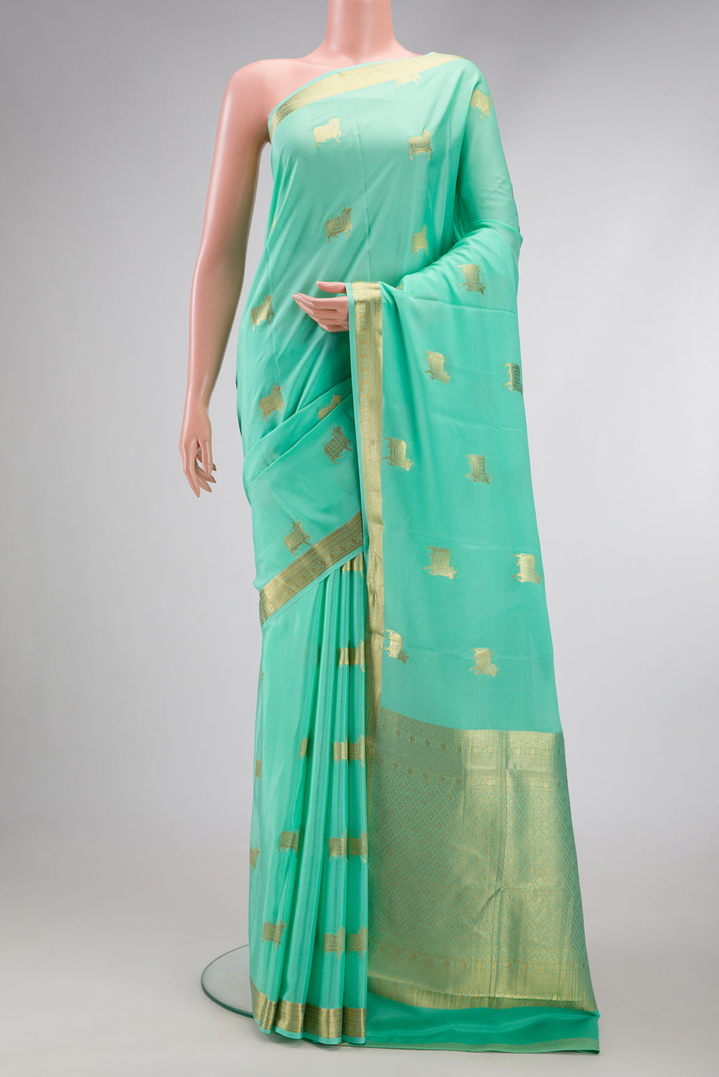 Sea Green Dual Tone Mysore Silk Saree with Zari Butta on the body and Zari Border.  displayed on a mannequin