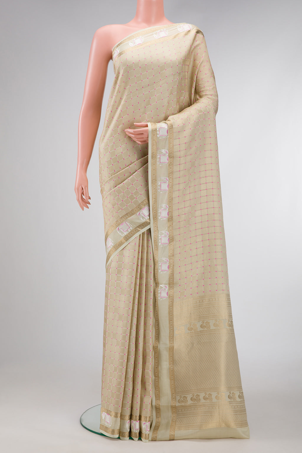 Beige Dual Tone Mysore Silk Saree with Zari Brocade on the body and Fancy Border.  displayed on a mannequin