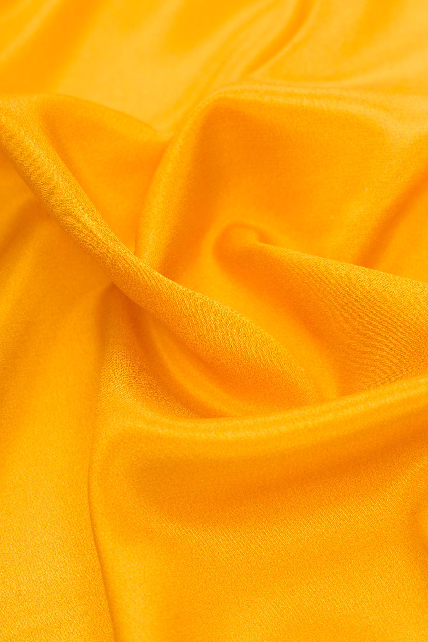 Close up of Mustard Dual Tone Mysore Silk Saree with Plain Body and Fancy Border.  displaying folds