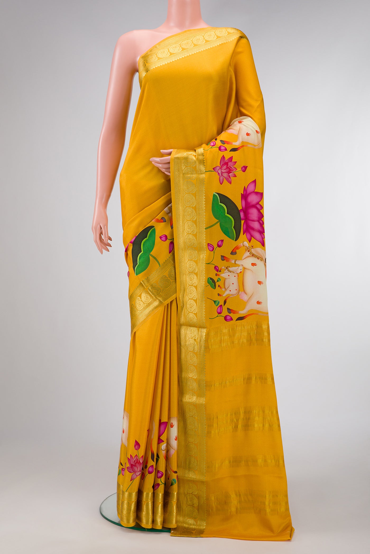 Mustard Dual Tone Mysore Silk Saree with Plain Body and Fancy Border.  displayed on a mannequin
