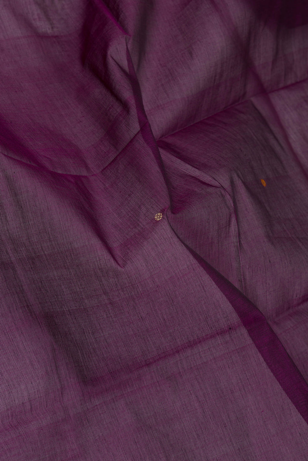 Close up of Purple Kanchi Cotton Saree with Thread Butta on the body and Thread Border.  displaying folds