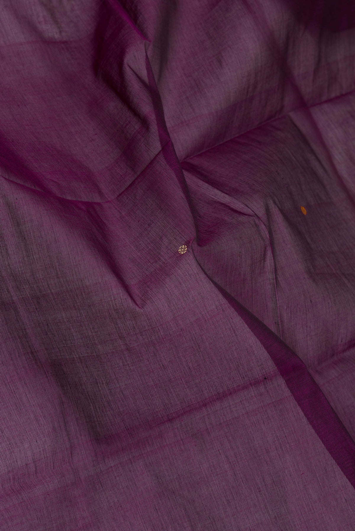 Close up of Purple Kanchi Cotton Saree with Thread Butta on the body and Thread Border.  displaying folds