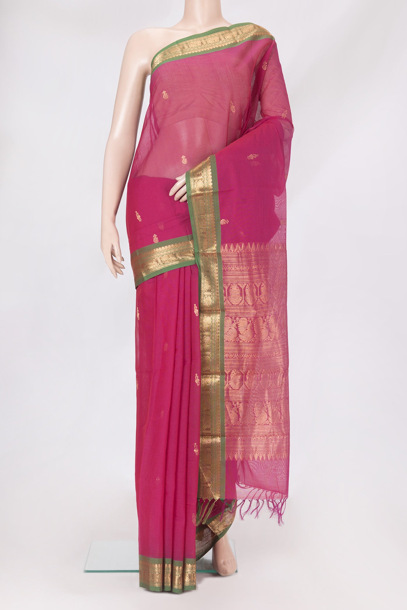 Pink Kanchi Cotton Saree with Zari Butta on the body and Zari Border.  displayed on a mannequin