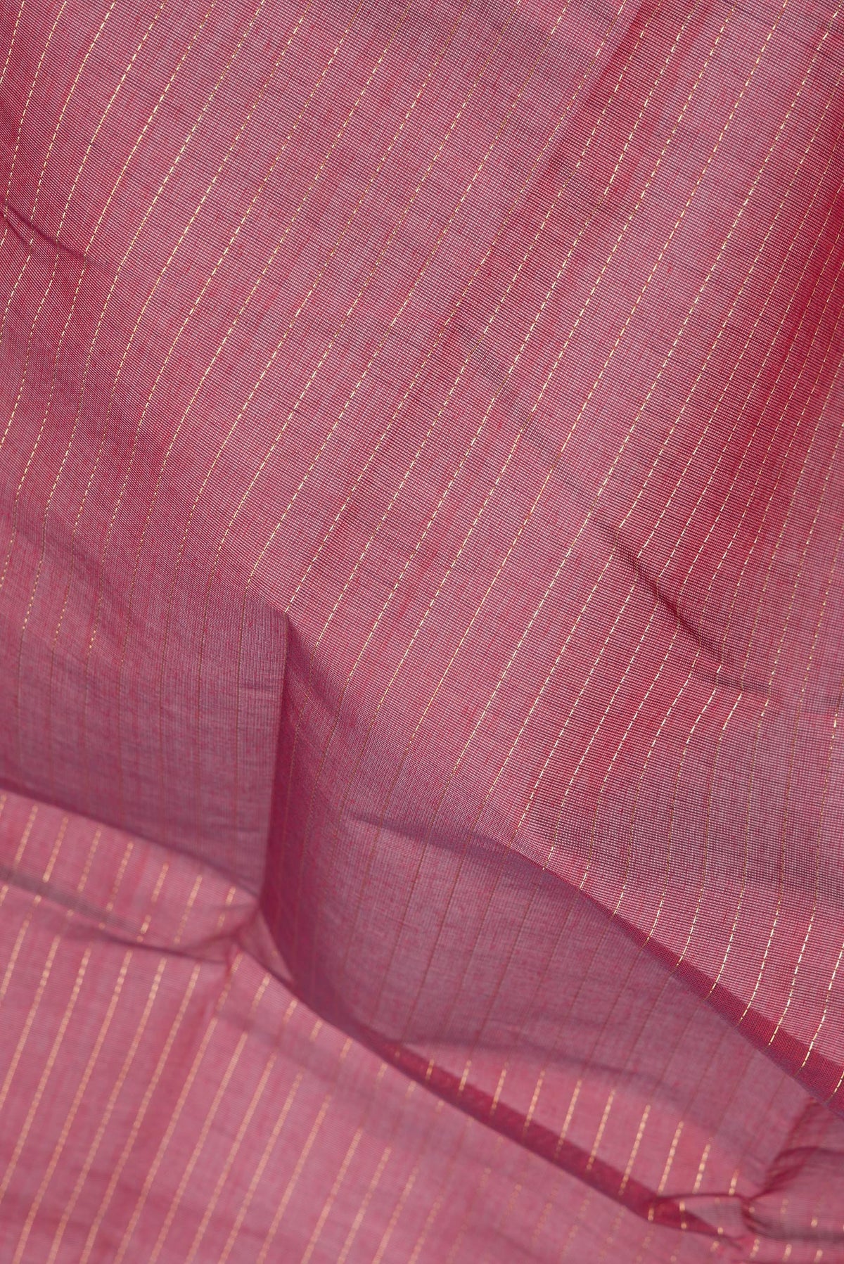 Close up of Maroon Kanchi Cotton Saree with Stripes on the body and Zari Border.  displaying folds