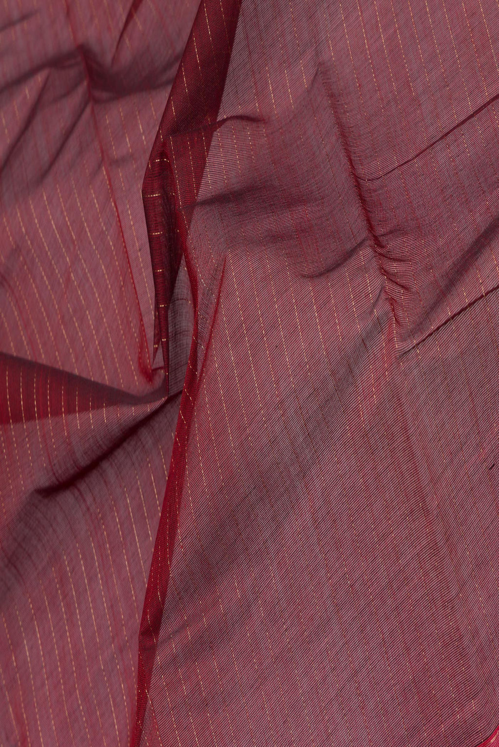 Close up of Maroon Kanchi Cotton Saree with Stripes on the body and Zari Border.  displaying folds