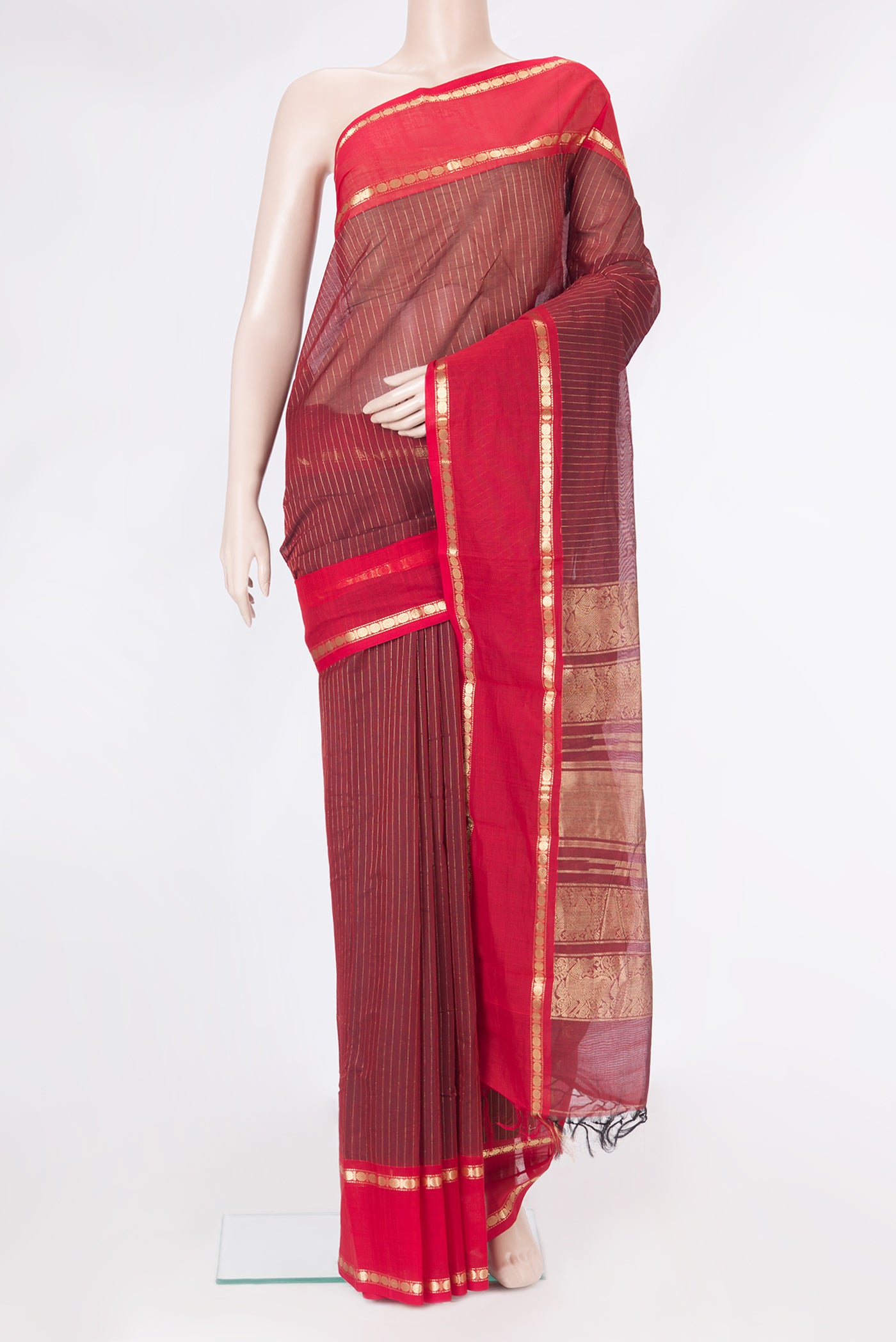 Maroon Kanchi Cotton Saree with Stripes on the body and Zari Border.  displayed on a mannequin