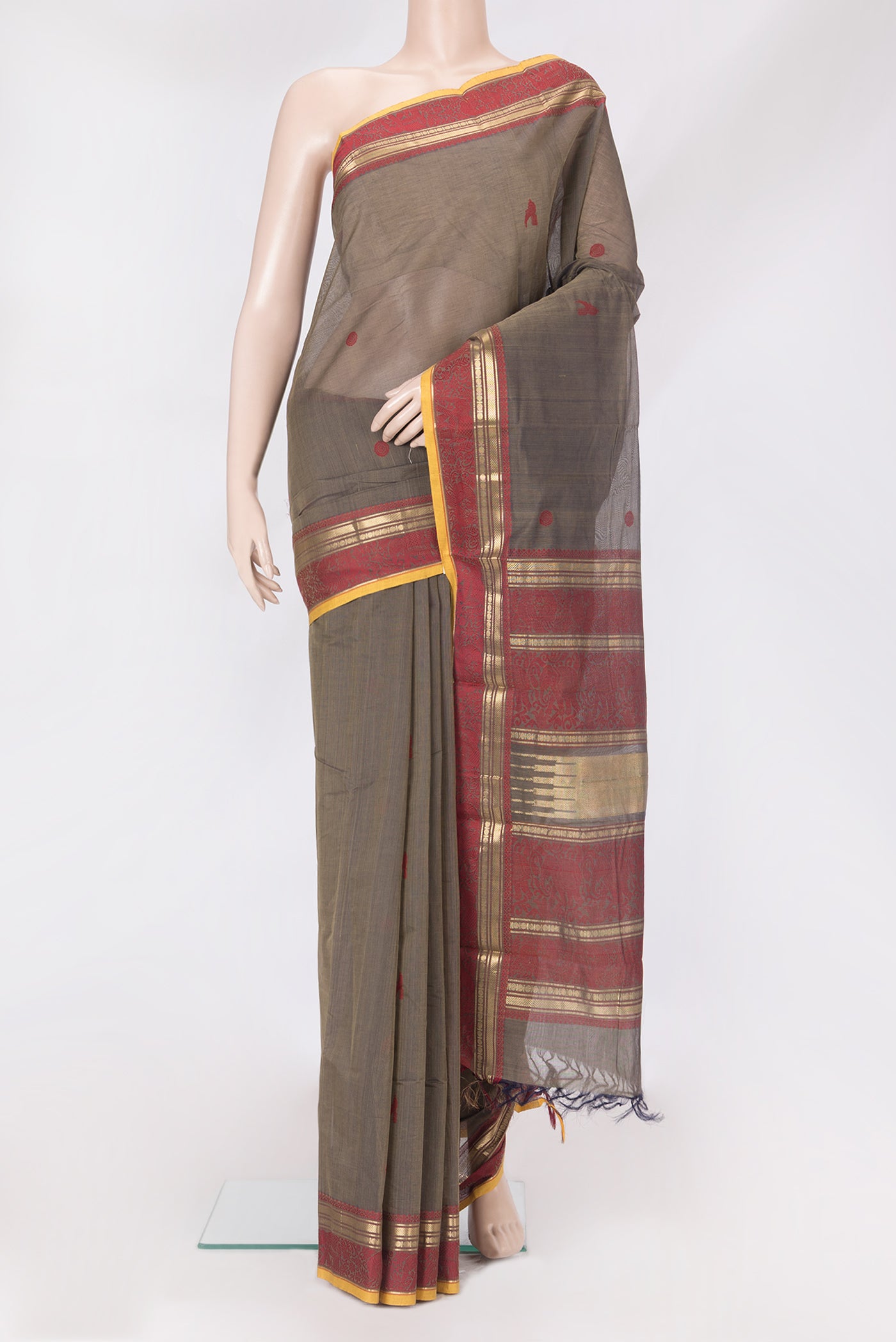 Brown Kanchi Cotton Saree with Thread Butta on the body and Zari And Thread Border.  displayed on a mannequin