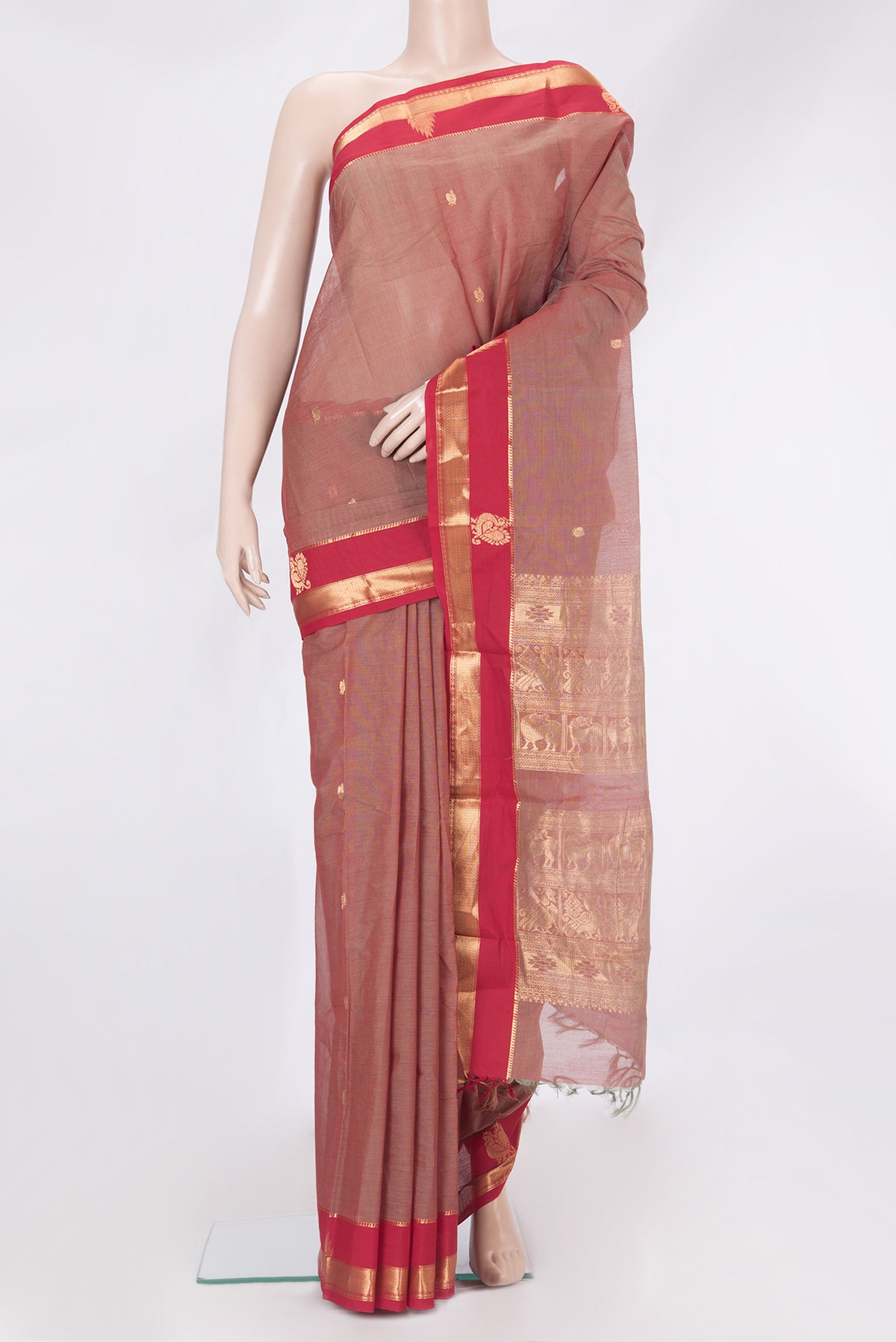 Rose Gold Kanchi Cotton Saree with Zari Butta on the body and Zari Border.  displayed on a mannequin