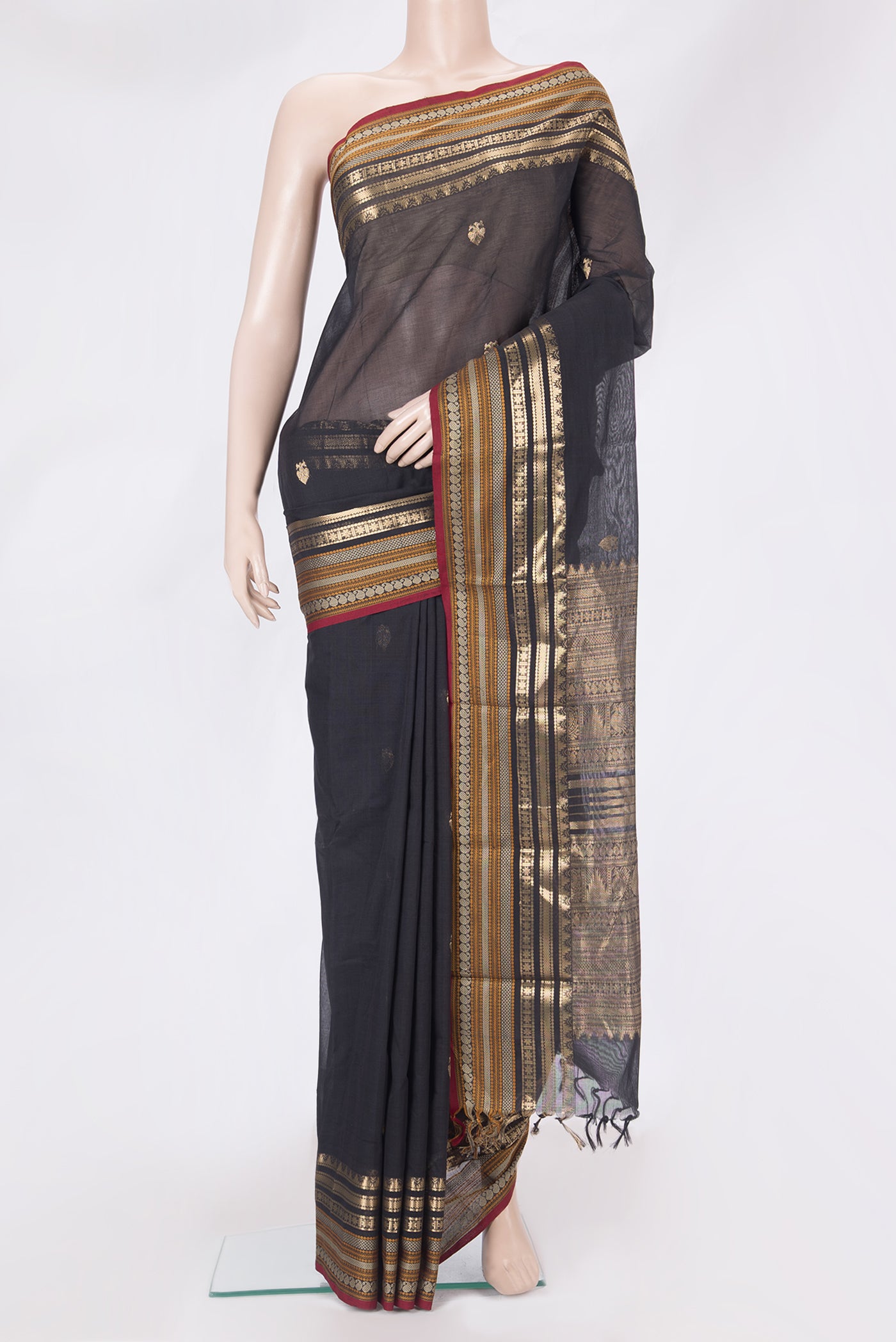 Black Kanchi Cotton Saree with Zari Butta on the body and Zari Border.  displayed on a mannequin