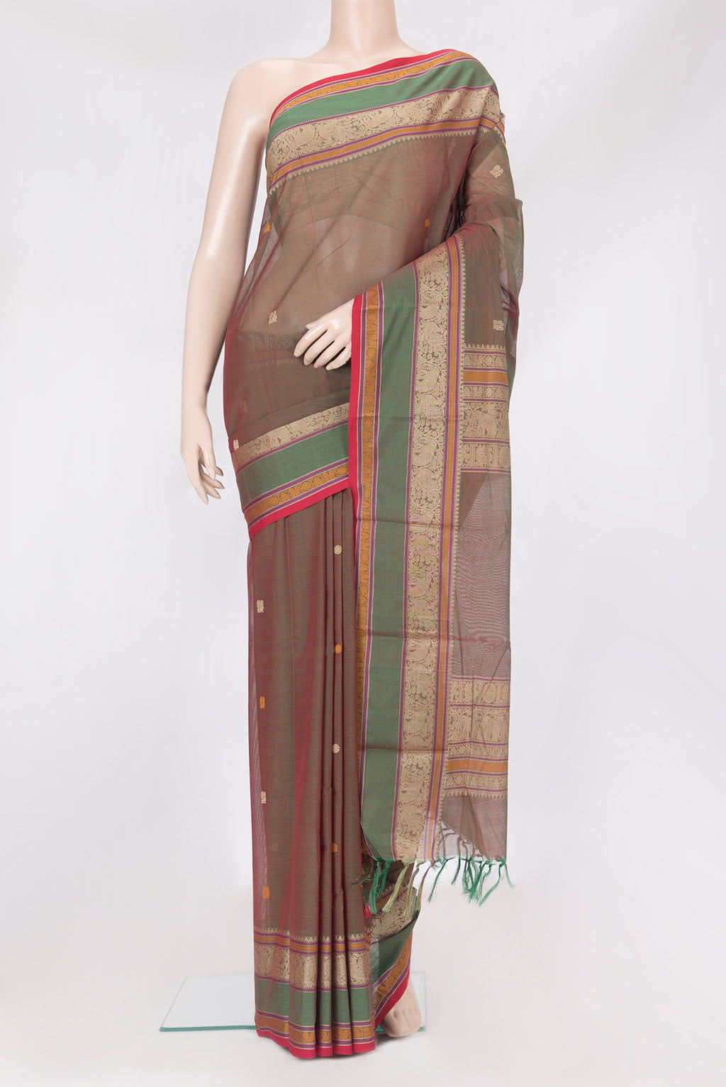 Green Dual Tone Kanchi Cotton Saree with Thread Butta on the body and Thread Border.  displayed on a mannequin
