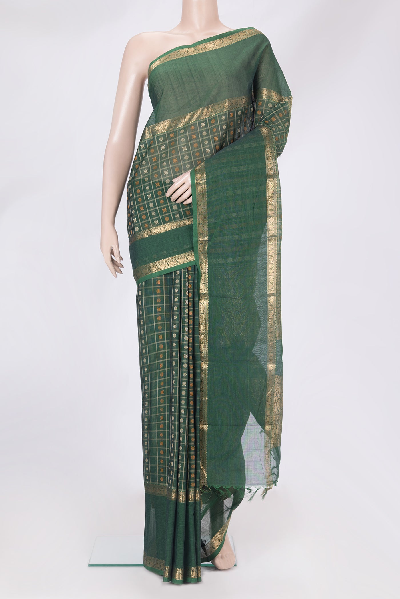 Bottle Green Kanchi Cotton Saree with Checked design on the body and Zari Border.  displayed on a mannequin