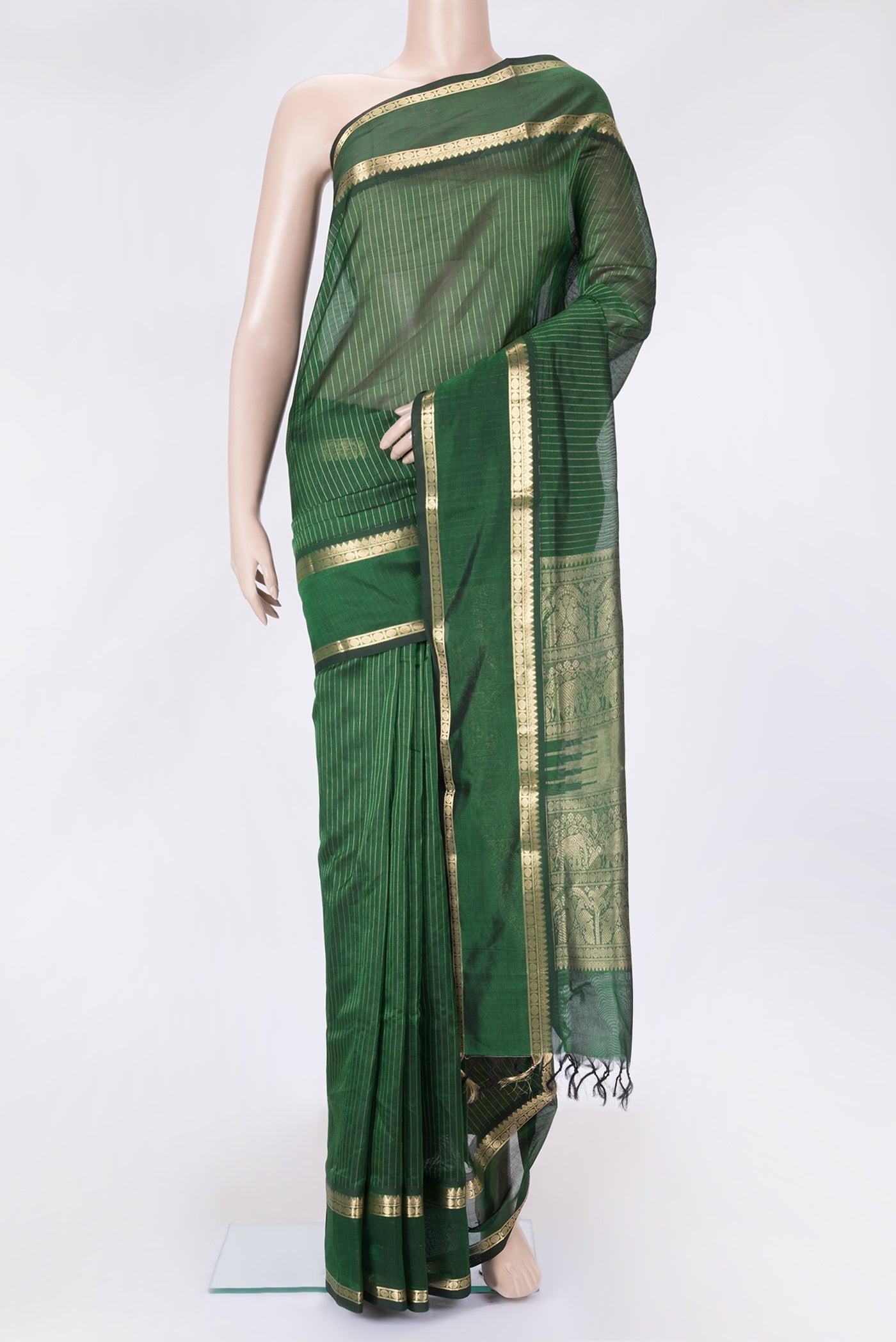 Green Dual Tone Silk Cotton Saree with Stripes on the body and Zari Border.  displayed on a mannequin
