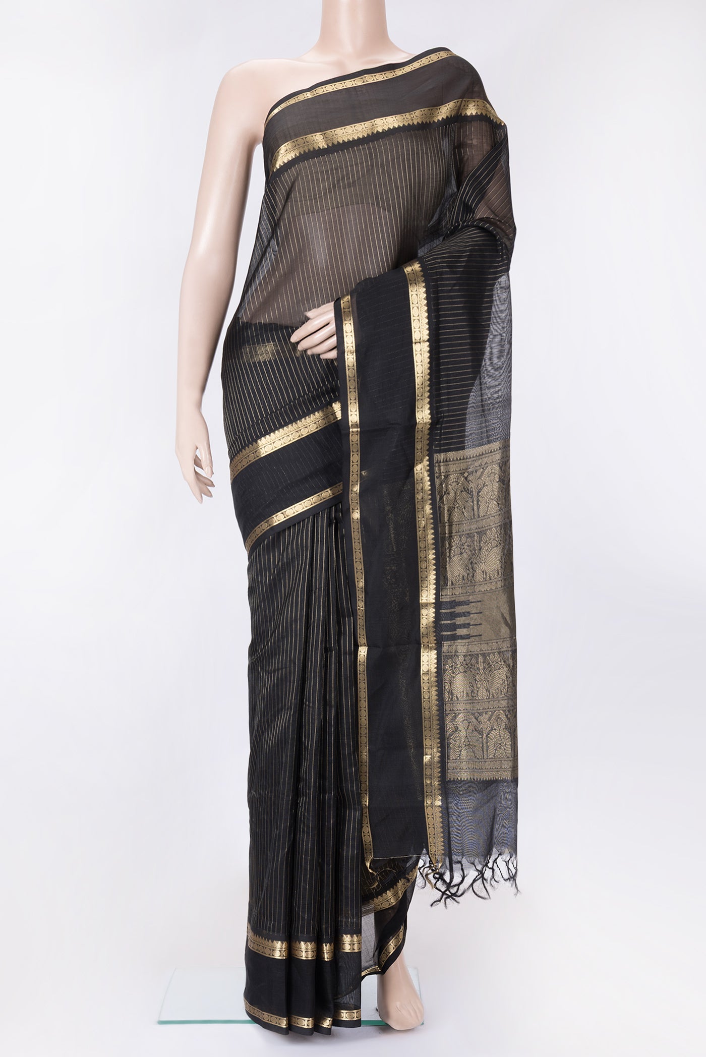 Black Dual Tone Silk Cotton Saree with Stripes on the body and Zari Border.  displayed on a mannequin