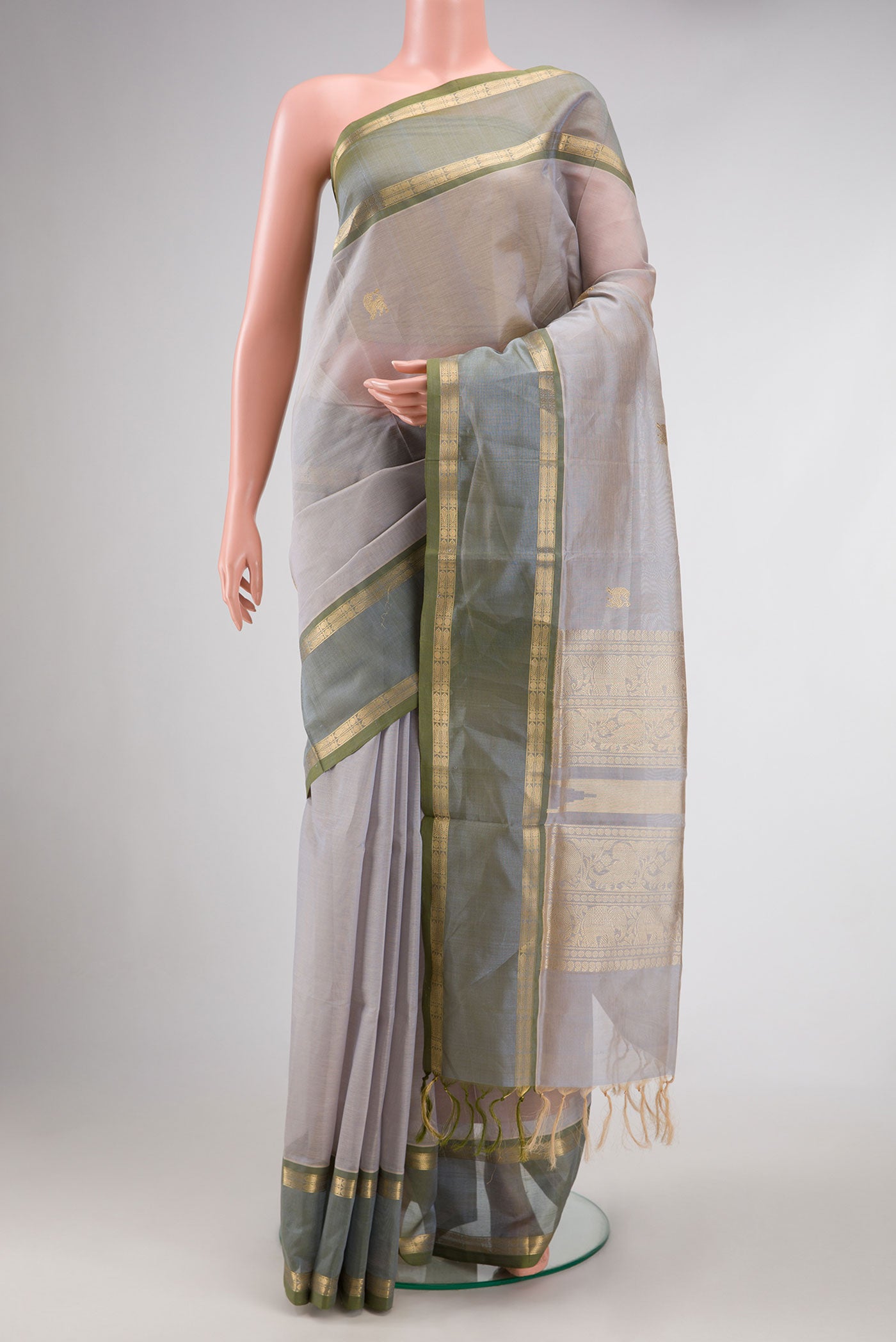 Grey Dual Tone Silk Cotton Saree with Zari Butta on the body and Zari Border.  displayed on a mannequin