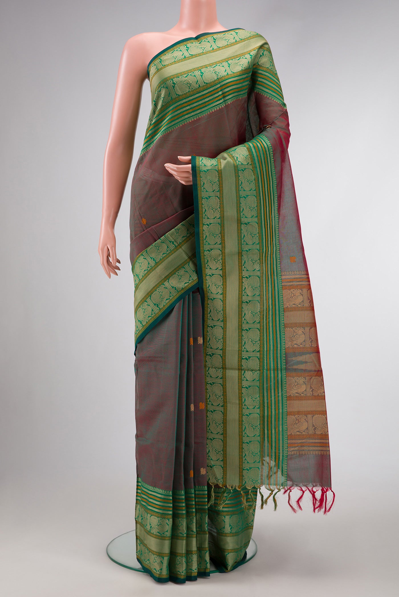 Red Dual Tone Silk Cotton Saree with Thread Butta on the body and Zari Border.  displayed on a mannequin