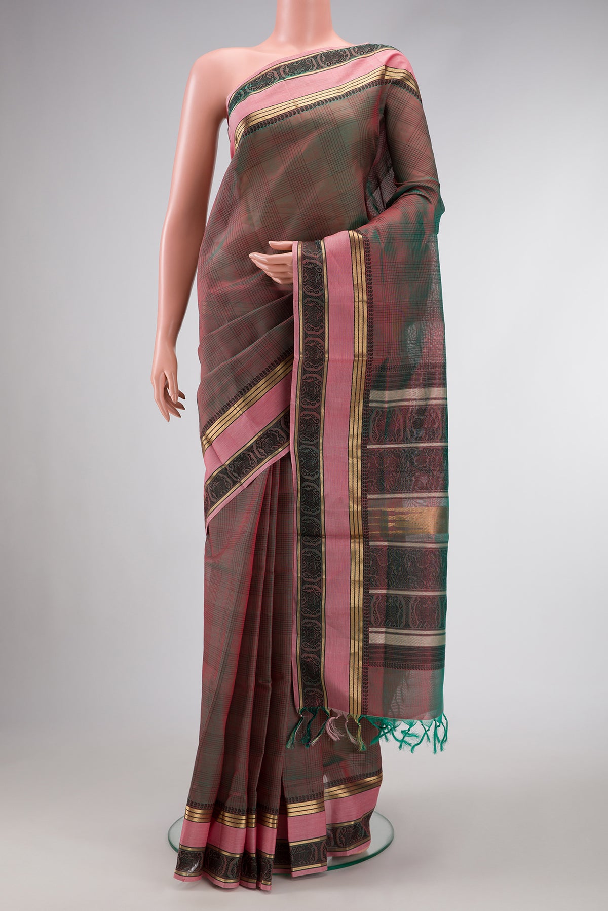 Green Dual Tone Silk Cotton Saree with Plain Body and Zari Border.  displayed on a mannequin