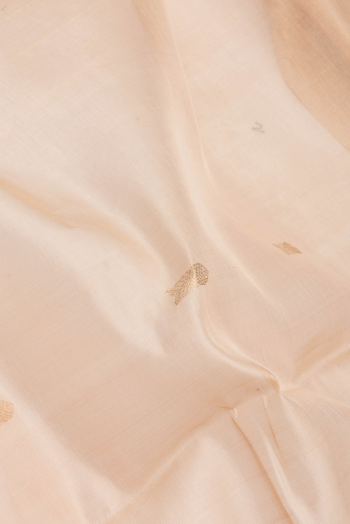 Close up of Sandal Dual Tone Silk Cotton Saree with Zari Butta on the body and Zari Border.  displaying folds