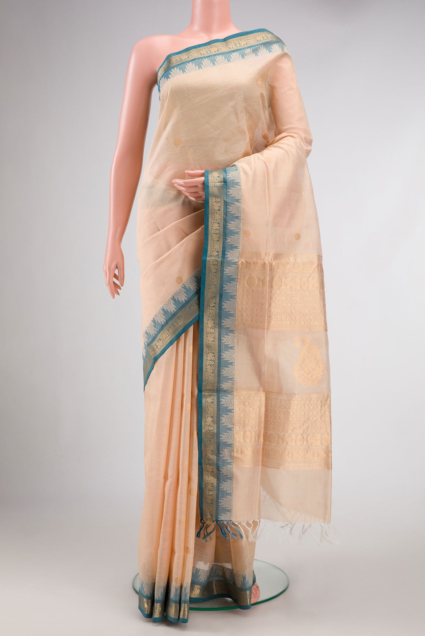 Sandal Dual Tone Silk Cotton Saree with Zari Butta on the body and Zari Border.  displayed on a mannequin