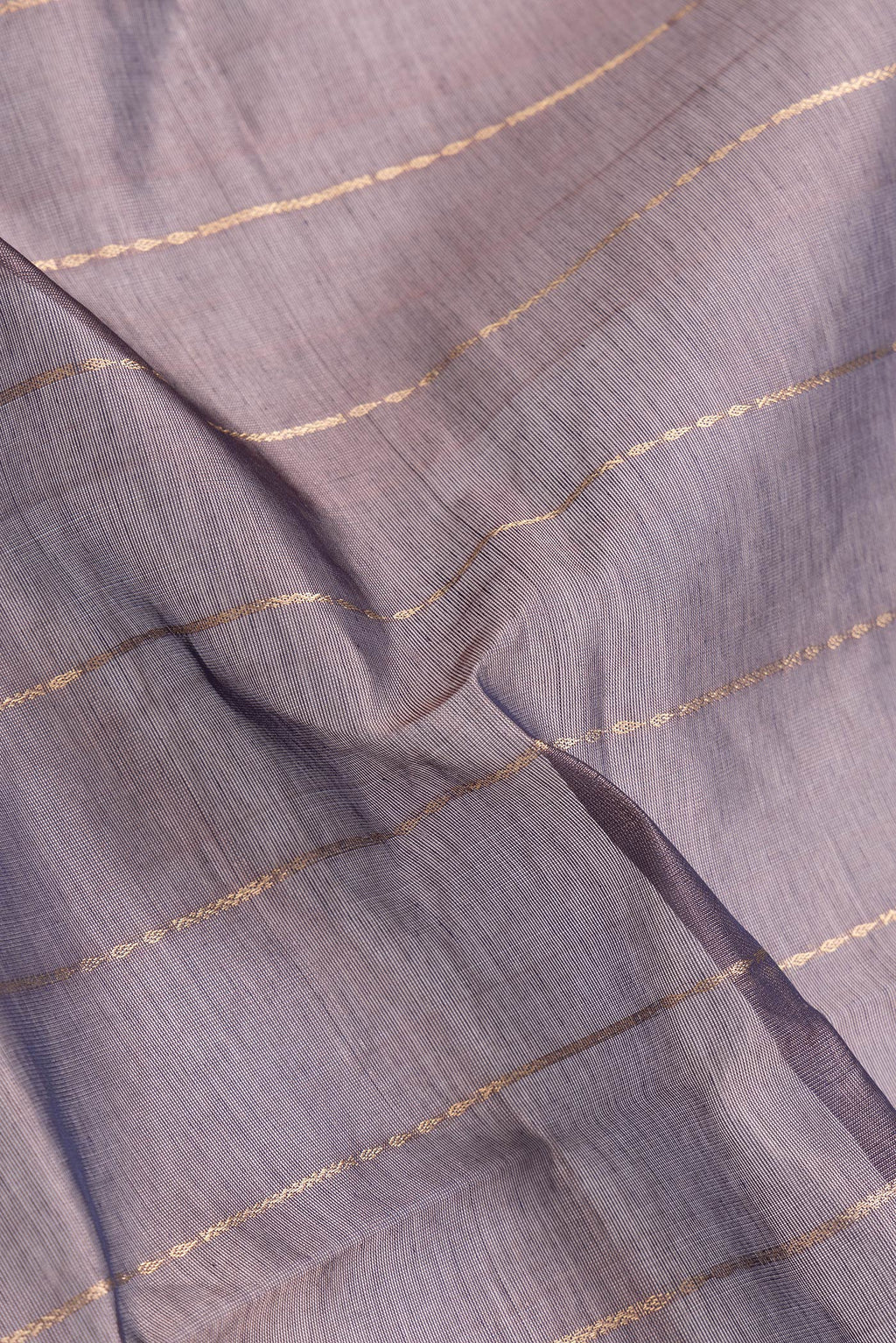 Close up of Burgundy Dual Tone Silk Cotton Saree with Stripes on the body and Zari Border.  displaying folds