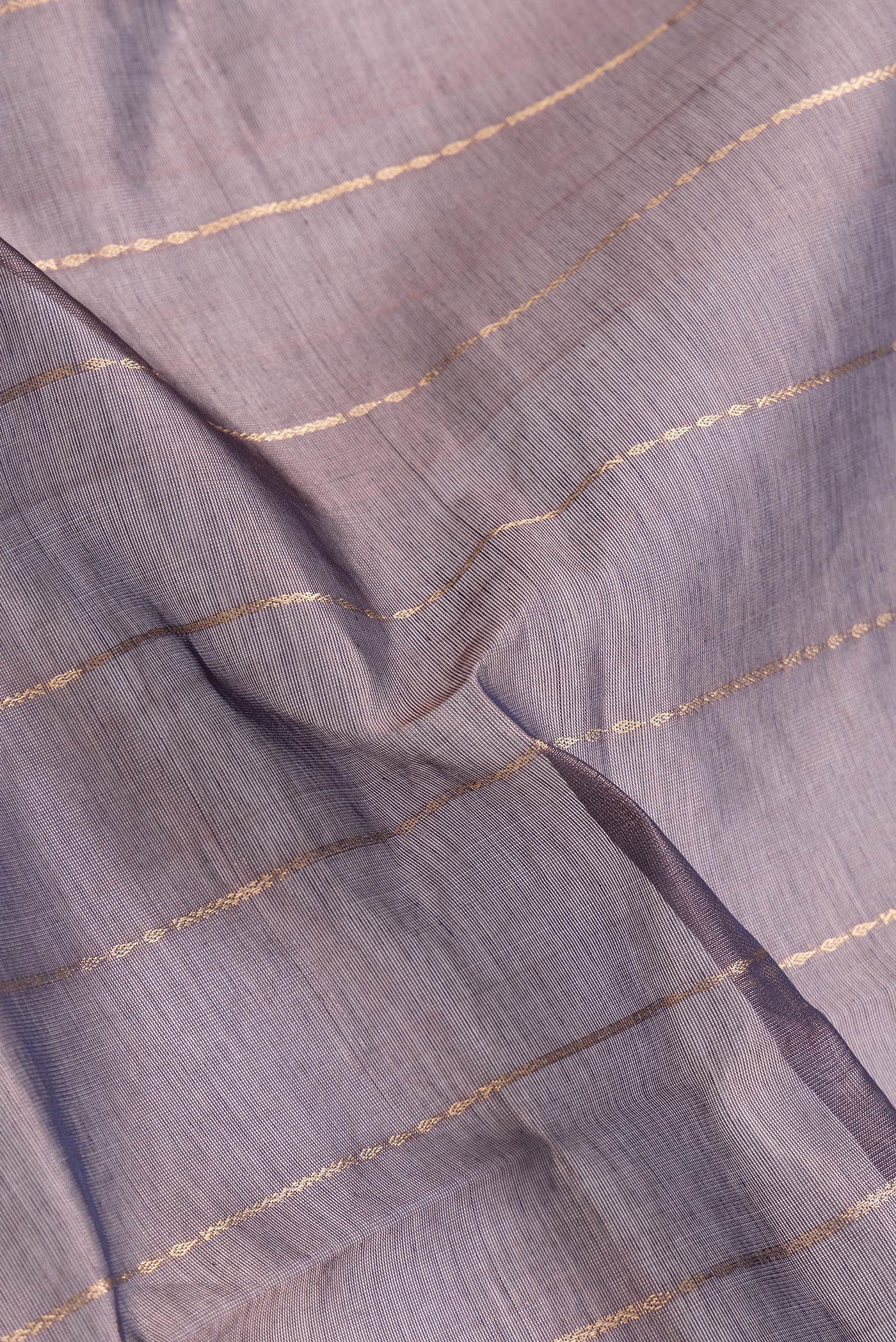 Close up of Burgundy Dual Tone Silk Cotton Saree with Stripes on the body and Zari Border.  displaying folds