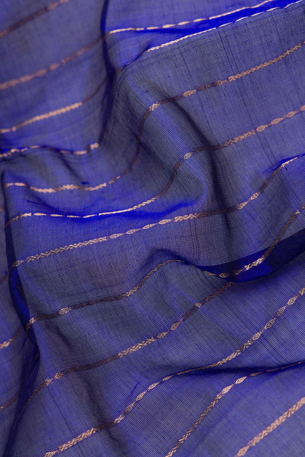 Close up of Royal Blue Dual Tone Silk Cotton Saree with Stripes on the body and Zari Border.  displaying folds