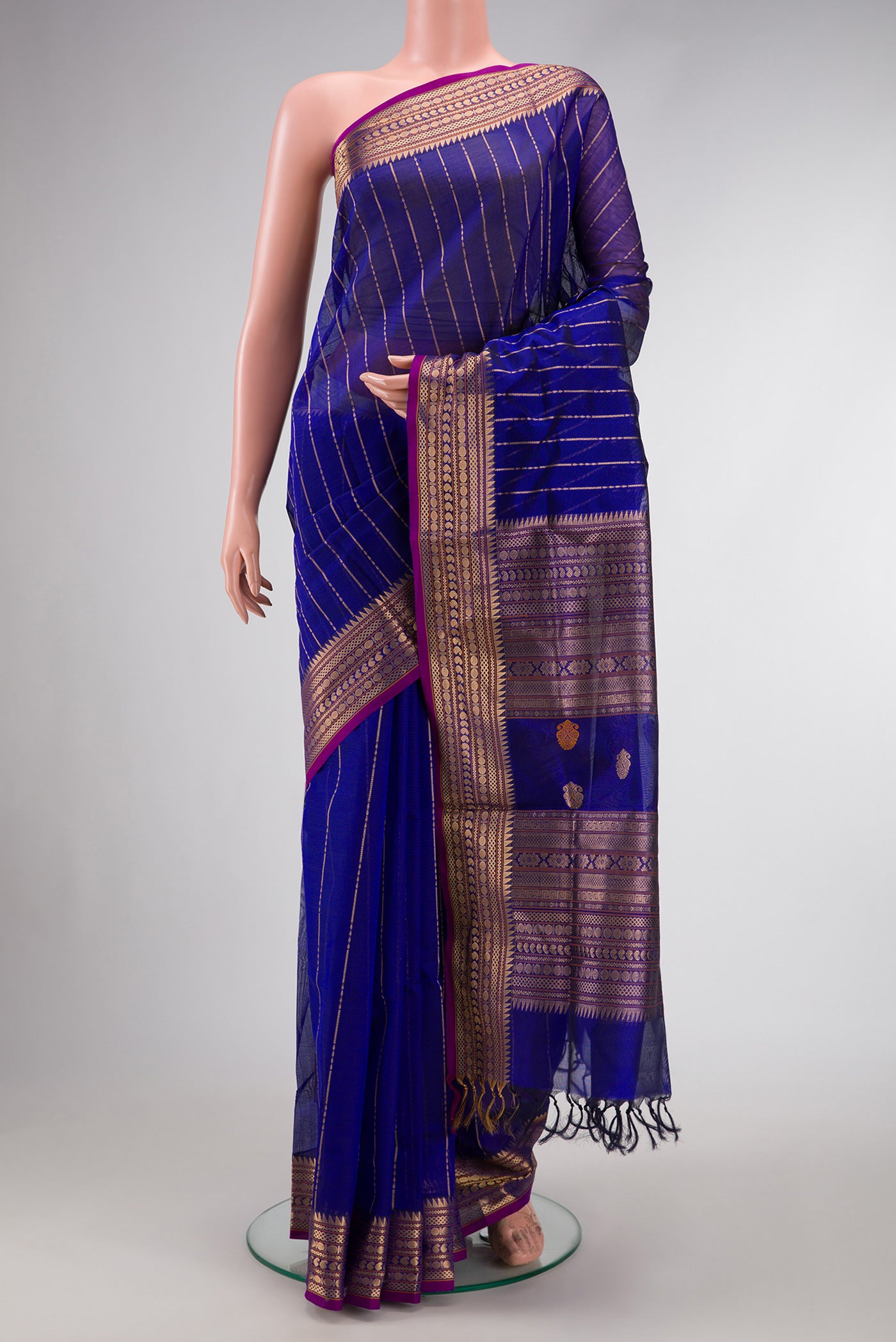 Royal Blue Dual Tone Silk Cotton Saree with Stripes on the body and Zari Border.  displayed on a mannequin
