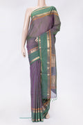 Green Dual Tone Silk Cotton Saree with Thread Butta on the body and Zari Border.  displayed on a mannequin