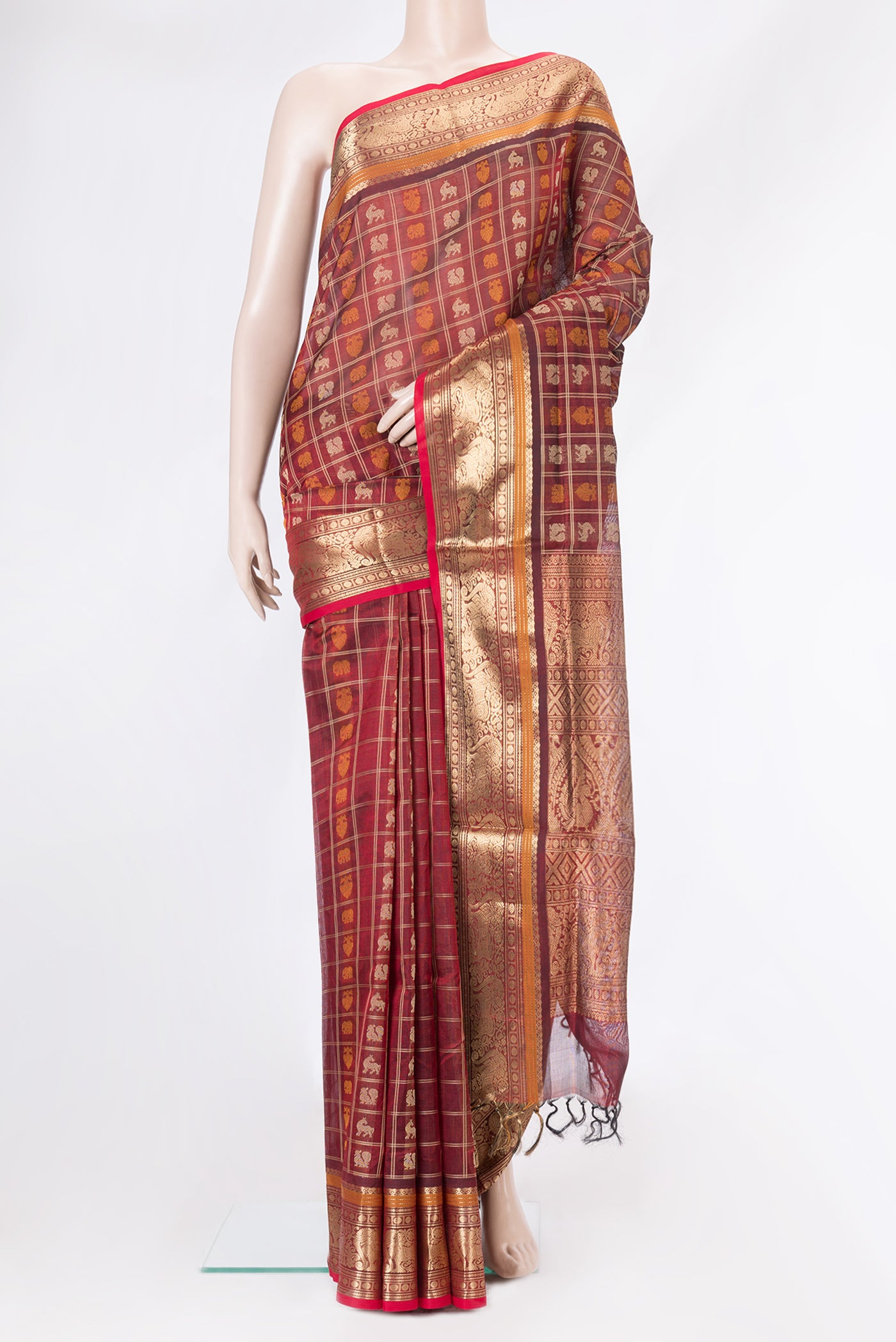 Maroon Dual Tone Silk Cotton Saree with Checked design on the body and Zari Border.  displayed on a mannequin