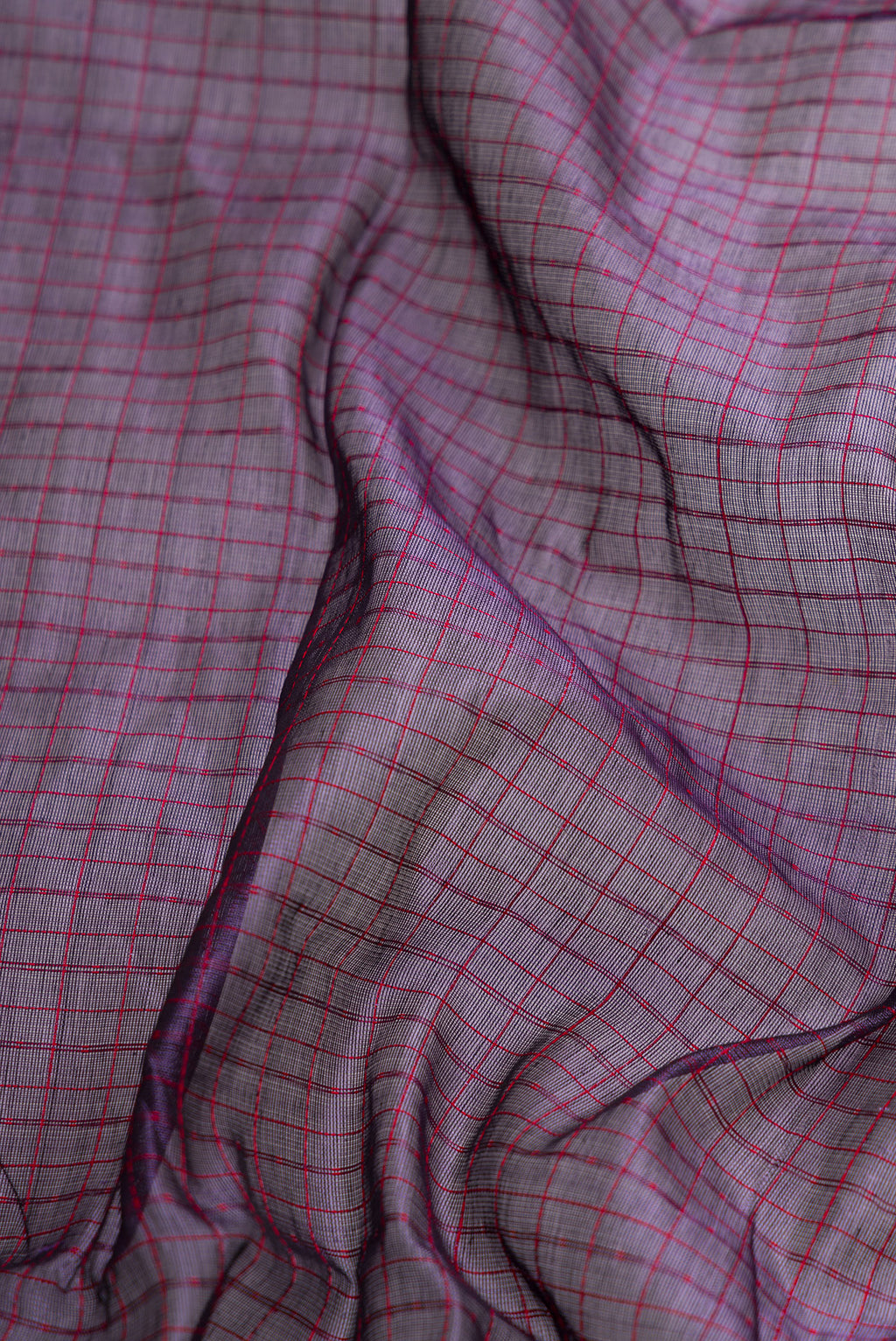 Close up of Violet Dual Tone Silk Cotton Saree with Checked design on the body and Zari Border.  displaying folds