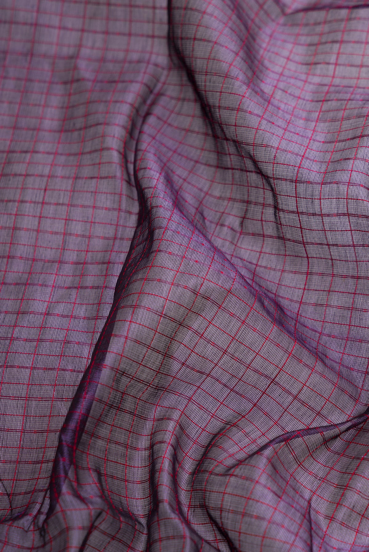 Close up of Violet Dual Tone Silk Cotton Saree with Checked design on the body and Zari Border.  displaying folds