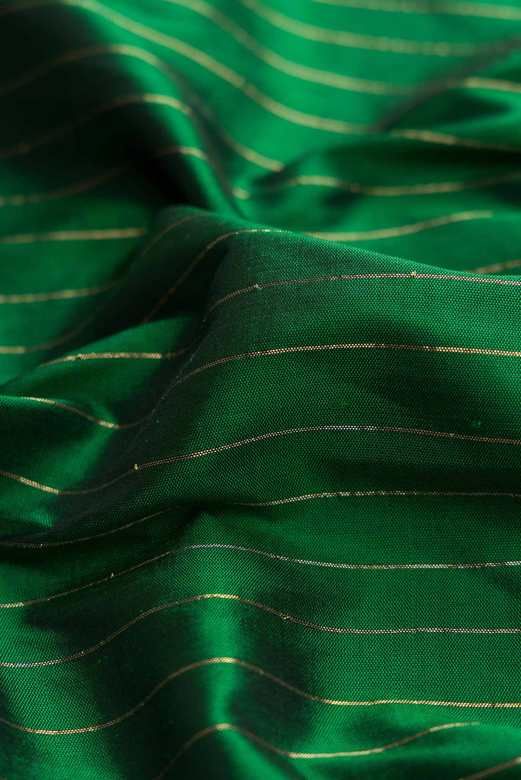 Close up of Bottle Green Dual Tone Paithani Silk Saree with Stripes on the body and Paithani Border displaying folds