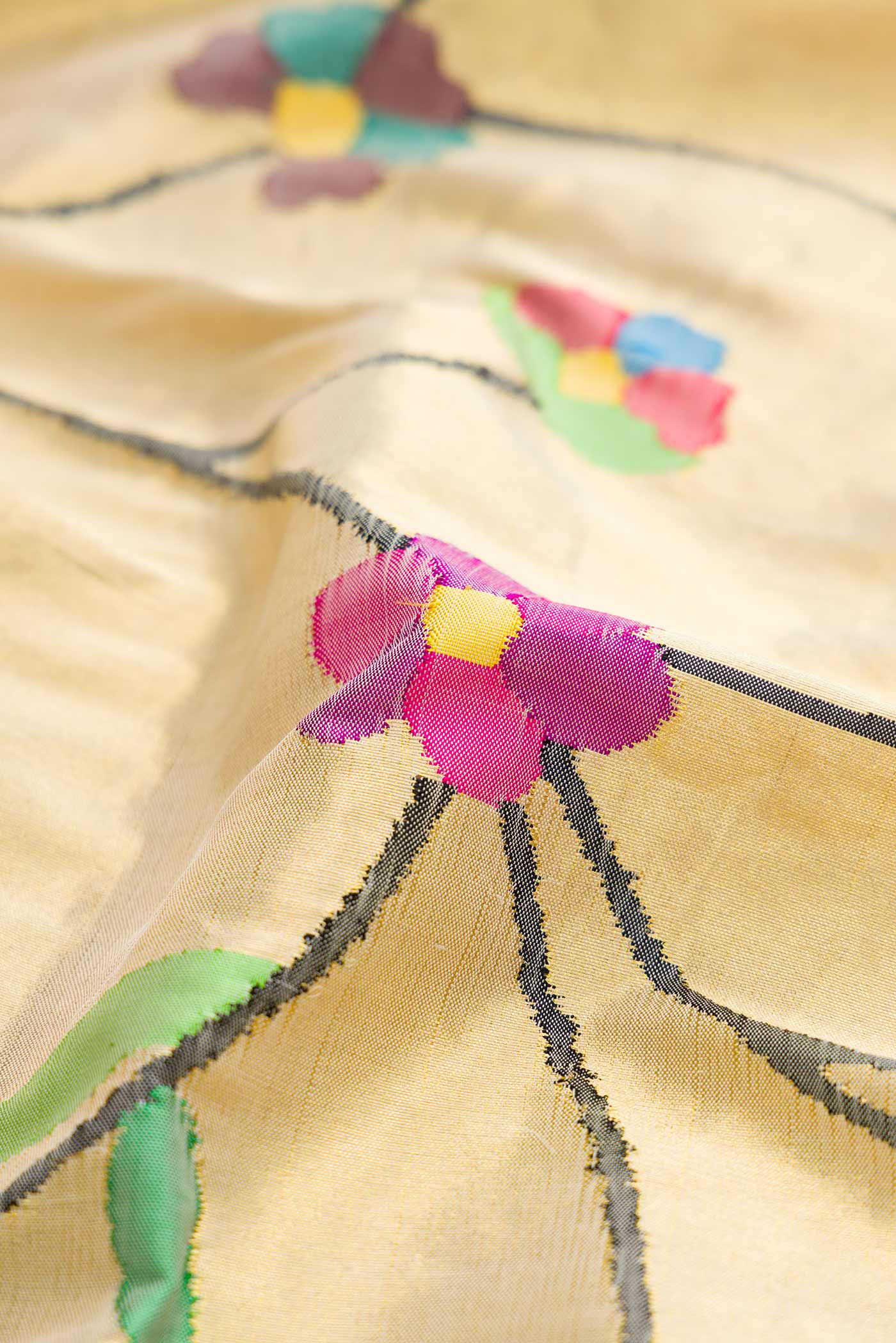 Close up of Pure Silk Pure Zari Gold Dual Tone Paithani Saree with Zari Brocade on the body and Paithani Border displaying folds