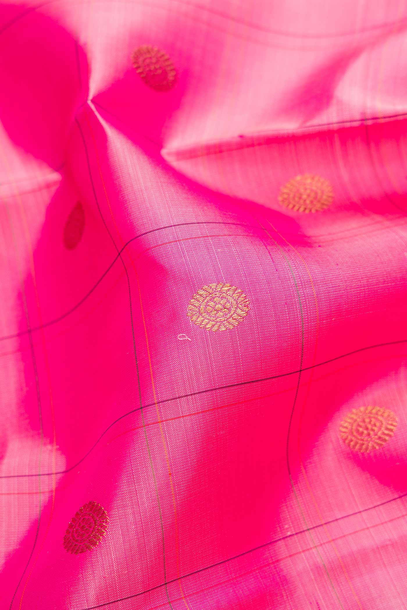 Close up of Pure Silk Pure Zari Pink Dual Tone Kanchipuram Saree with Checked design on the body and Zari Border.  displaying folds