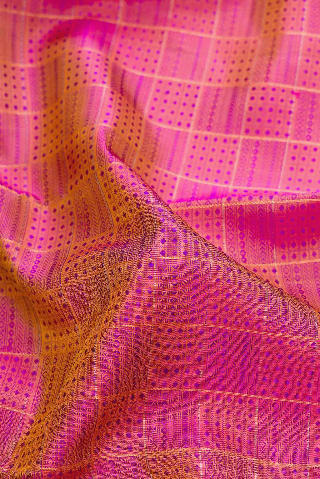 Close up of Pure Silk Pure Zari Purple Dual Tone Kanchipuram Saree with Jacquard With Zari Butta on the body and Zari Border.  displaying folds