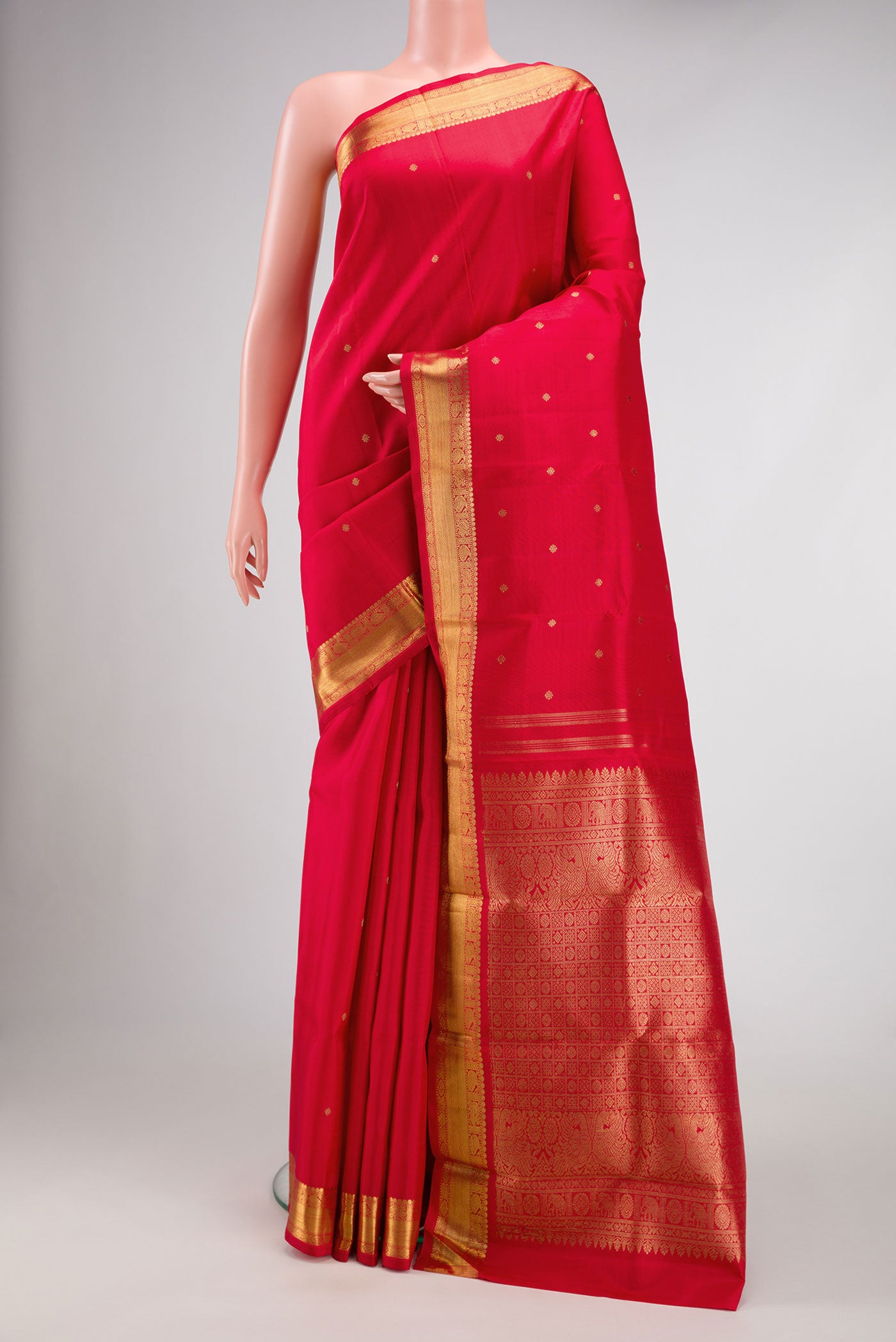 Pure Silk Pure Zari Red Dual Tone Kanchipuram Saree with Zari Butta on the body and Zari Border.  displayed on a mannequin