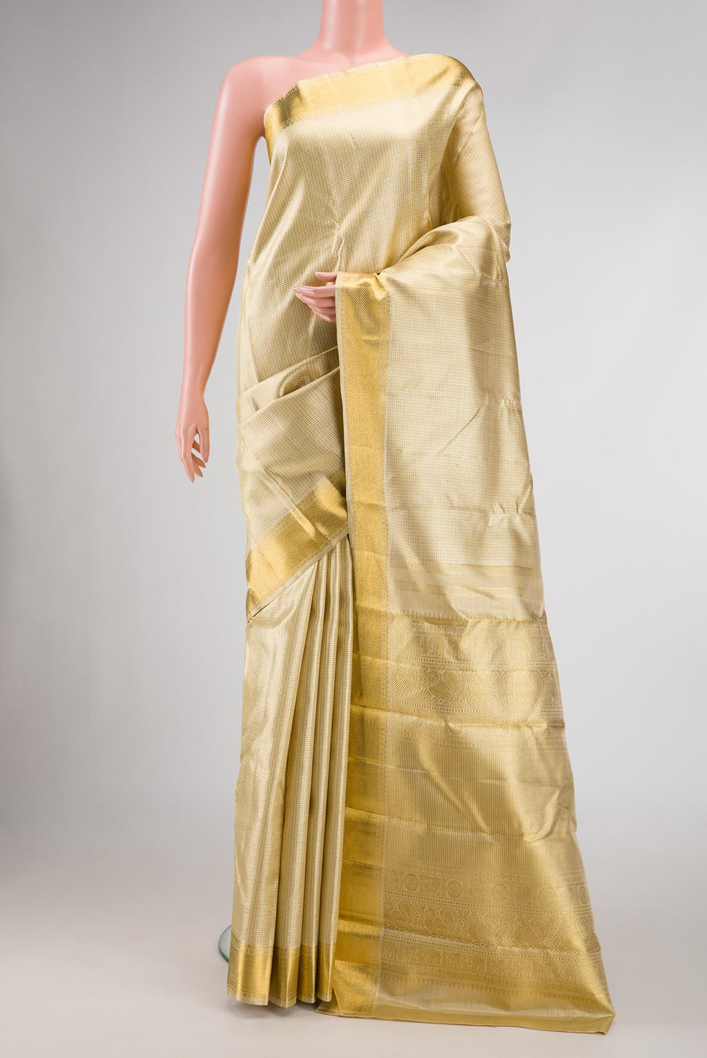 Pure Silk Pure Zari Gold Dual Tone Kanjivaram Saree with Zari Brocade on the body and Zari Border.  displayed on a mannequin