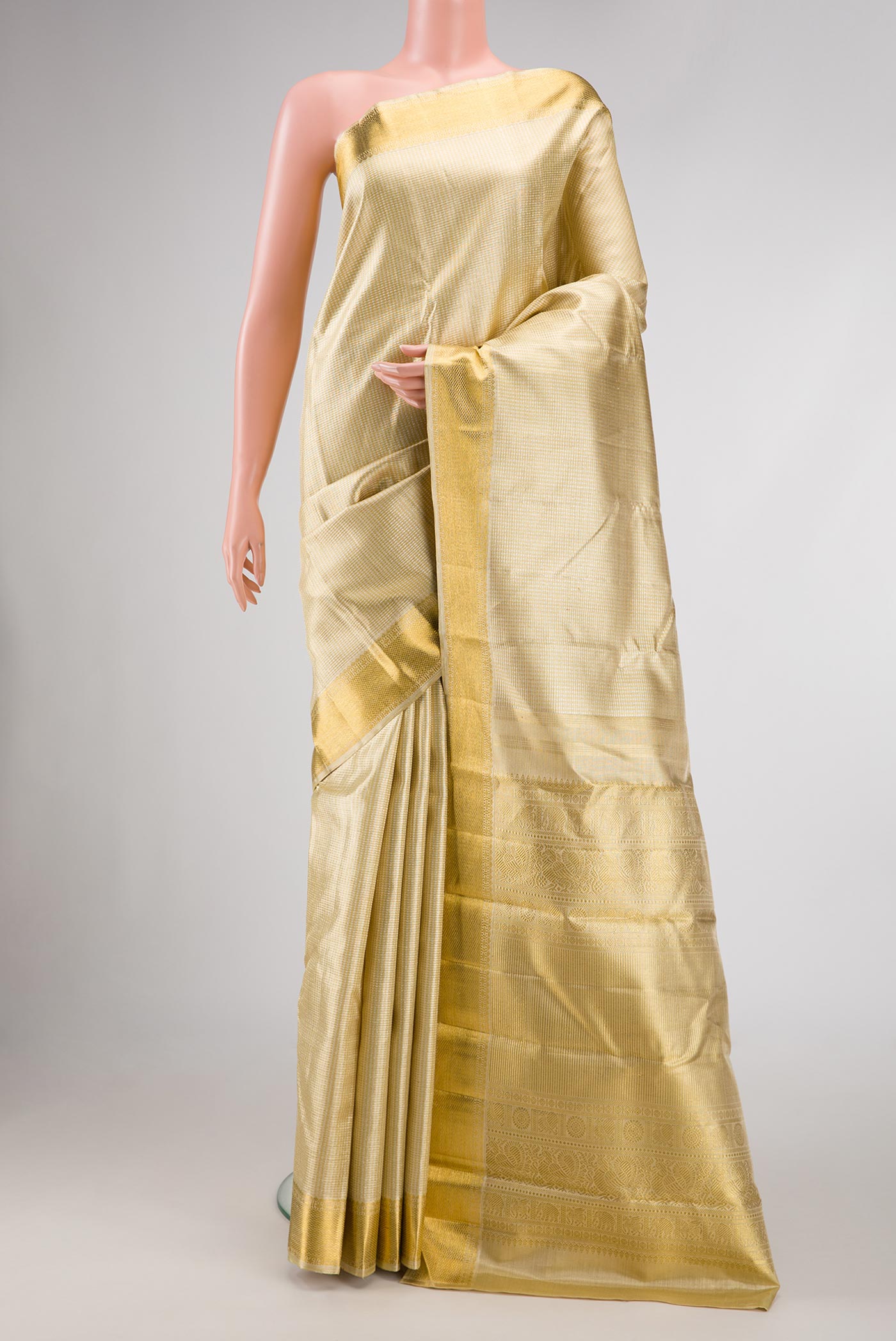 Pure Silk Pure Zari Gold Dual Tone Kanjivaram Saree with Zari Brocade on the body and Zari Border.  displayed on a mannequin