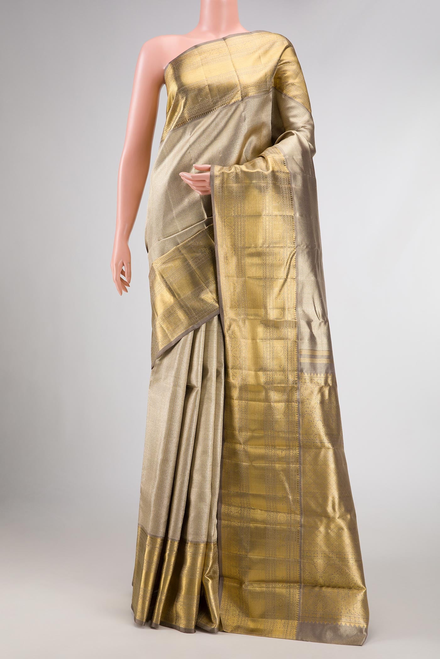 Pure Silk Pure Zari Grey Dual Tone Kanjivaram Tissue Saree with Zari Brocade on the body and Zari Border.  displayed on a mannequin